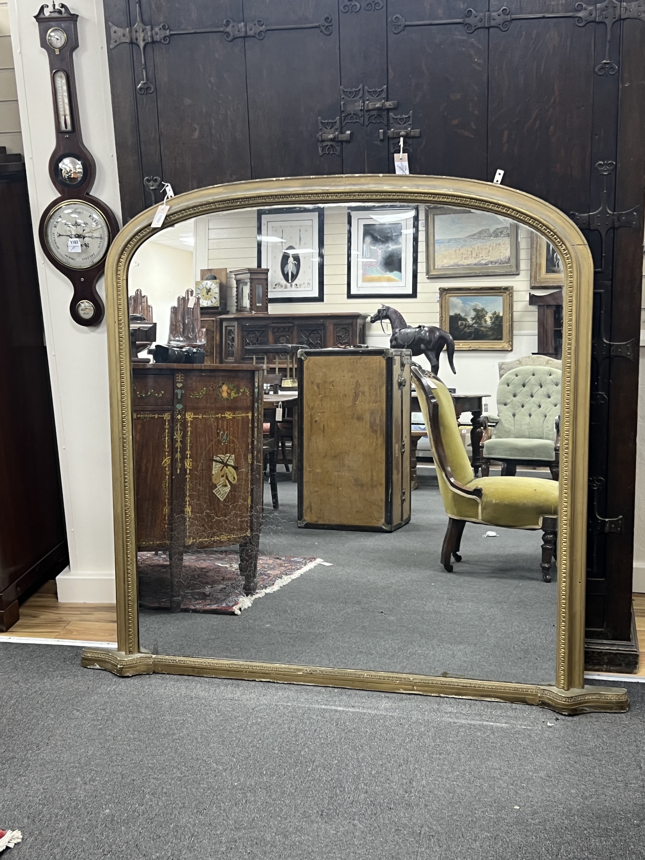 A Victorian giltwood and composition overmantel mirror, width 160cm, height 144cm